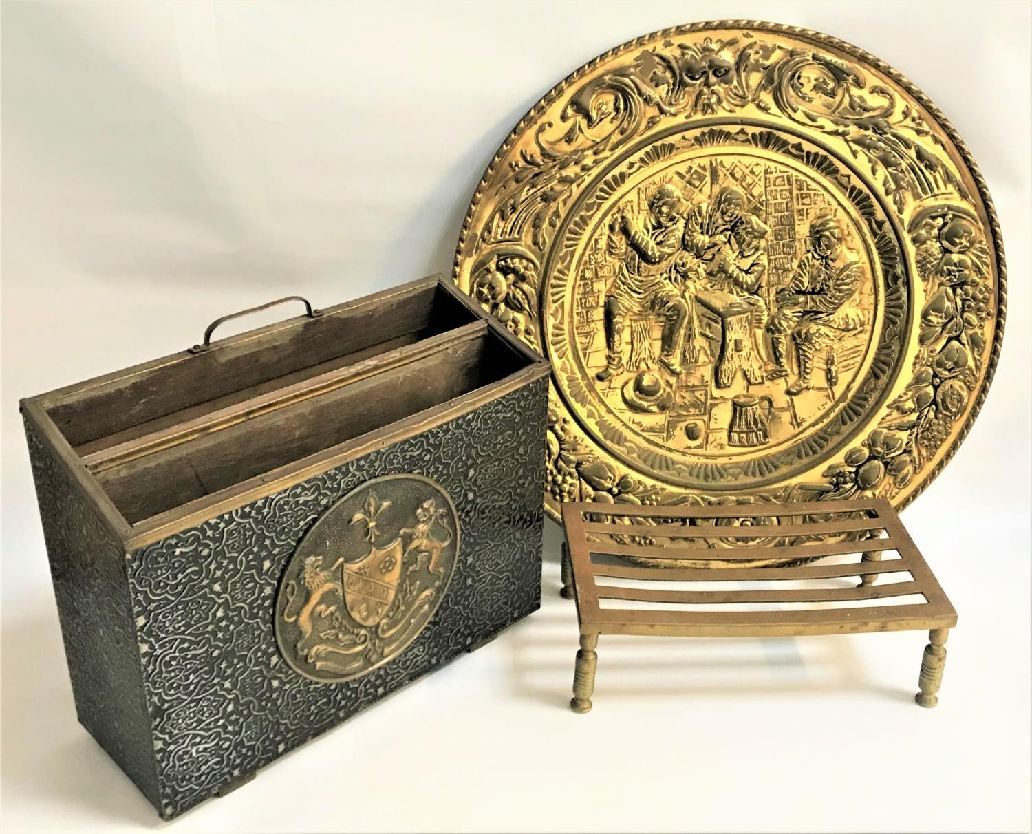 TWO DIVISION MAGAZINE RACK decorated with embossed brass with a central circular coat of arms