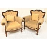 PAIR OF CONTINENTAL STYLE MAHOGANY ARMCHAIRS with a carved top rail above a button back and scroll