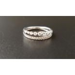 PRETTY DIAMOND SET DOUBLE ROW RING one row with graduated diamonds and the other a channel set
