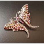 RUBY, MARCASITE AND ENAMEL BUTTERFLY BROOCH the body formed with rubies, the wings divided into