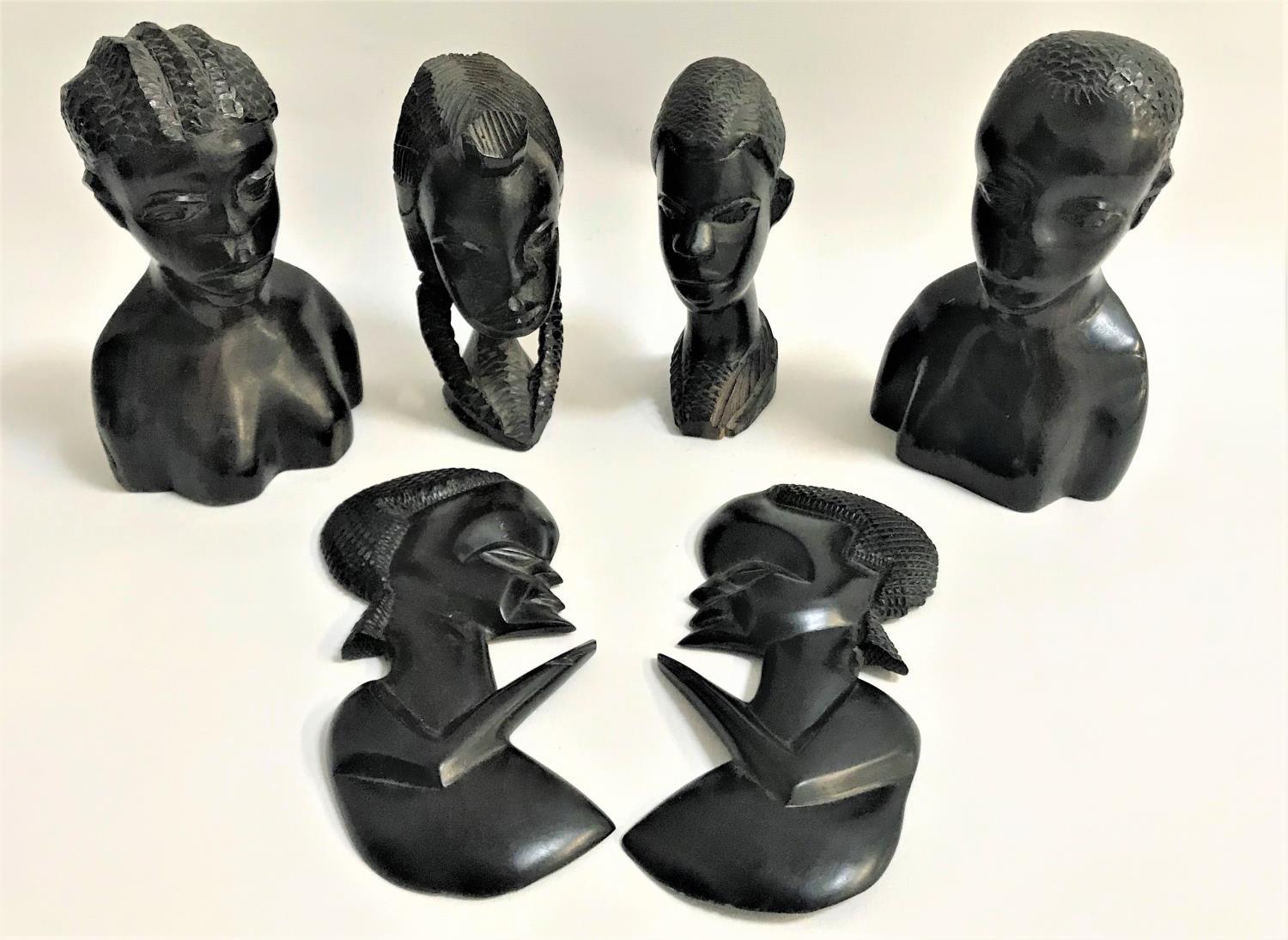 FOUR AFRICAN CARVED HARDWOOD BUSTS together with two relief carved busts (6)