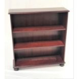 MAHOGANY OPEN BOOKCASE with a moulded top above an open front with two adjustable shelves,