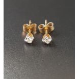 PAIR OF DIAMOND STUD EARRINGS the illusion set diamonds in unmarked gold, with nine carat gold