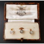 BOXED SET OF MOTHER AND PEARL AND SEED PEARL DECORATED STUDS the three studs in nine and eighteen