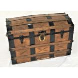 VINTAGE WOOD AND METAL BOUND TRAVEL TRUNK with a dome top opening to reveal a fold down flap to