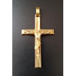 NINE CARAT GOLD CRUCIFIX PENDANT approximately 4.4 grams and 5.2cm high (including suspension loop)