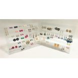 FIFTY-NINE PAIRS OF COSTUME JEWELLERY EARRINGS of various designs and sizes, studs and drops,