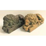 PAIR OF RECUMBENT PLASTER LIONS on plinth bases, one in a verdigris and one in a gilt finish, 42cm
