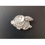 MARCASITE AND RUBY DECORATED SILVER FLYING PIG BROOCH/ PENDANT with ruby eye and marcasites overall,