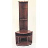 MAHOGANY FLOOR STANDING CORNER UNIT with a moulded top above a glass shelf and four wood shelves,