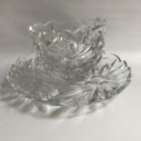 EXTREMELY DECORATIVE CONTINENTAL CRYSTAL PUNCH BOWL AND TRAY each with an irregular rim , the bodies