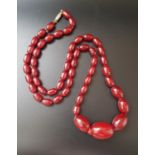 GRADUATED CHERRY AMBER BEAD NECKLACE 75cm long and approximately 44 grams
