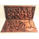 TWO INDONESIAN RELIEF CRAVED RECTANGULAR TEAK PANELS one with village scene and villagers carrying