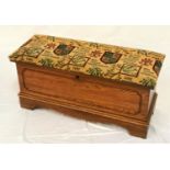 LANE OF VIRGINIA OAK BLANKET BOX with an upholstered padded lift up lid above a carved panel