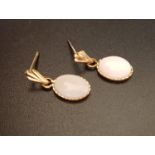 PAIR OF OPAL DROP EARRINGS in unmarked gold with nine carat gold butterflies