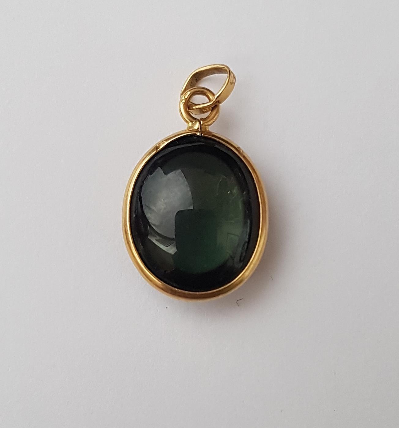 FULL ROUNDED CABOCHON TOURMALINE PENDANT in nine carat gold mount, 1.9cm high (including