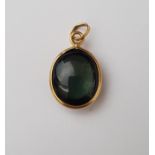 FULL ROUNDED CABOCHON TOURMALINE PENDANT in nine carat gold mount, 1.9cm high (including