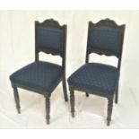 PAIR OF EDWARDIAN OAK DINING CHAIRS with shaped top rails above padded backs and stuffover seats