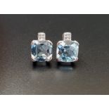 PAIR OF BLUE TOPAZ AND DIAMOND STUD EARRINGS the cushion cut blue topaz on each approximately 2cts