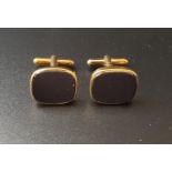 PAIR OF ONYX SET NINE CARAT GOLD CUFFLINKS in box, total weight approximately 7.6 grams