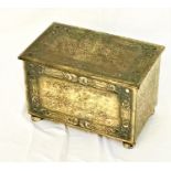 EMBOSSED BRASS COAL BIN with a lift up lid revealing a removeable steel liner, standing on flattened