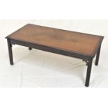 MAHOGANY AND CROSSBANDED OBLONG OCCASIONAL TABLE standing on shaped supports, 121cm wide