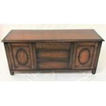 OAK COFFER with a moulded lift up lid above a panelled front, standing on stille supports, 137cm