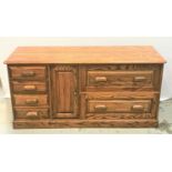 SOLID OAK SIDE CABINET with a moulded top above four panelled drawers, a panelled cupboard door