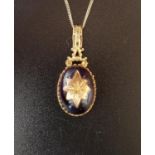VICTORIAN STYLE AMETHYST PENDANT the cabochon amethyst in nine carat gold mount and with central