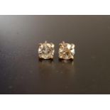 DIAMOND SOLITAIRE EARRINGS the round cut diamonds totalling approximately 1ct, in unmarked gold