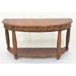 CHERRY DEMI LUNE CONSOLE TABLE with a crossbanded top above a decorative carved frieze, standing