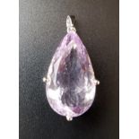 IMPRESSIVE AMETHYST SOLITAIRE PENDANT the large pear cut amethyst with faceted underside and