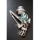 RUBY, MARCASITE AND ENAMEL DECORATED SILVER BEAR BROOCH the bear modelled as a fishesman, with