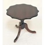 MAHOGANY TRIPOD OCCASIONAL TABLE with a shaped circular top on a turned column with three outswept