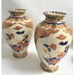 PAIR OF LARGE JAPANESE PANDA POTTERY VASES with floral, gilt and motif decoration, 41.5cm high