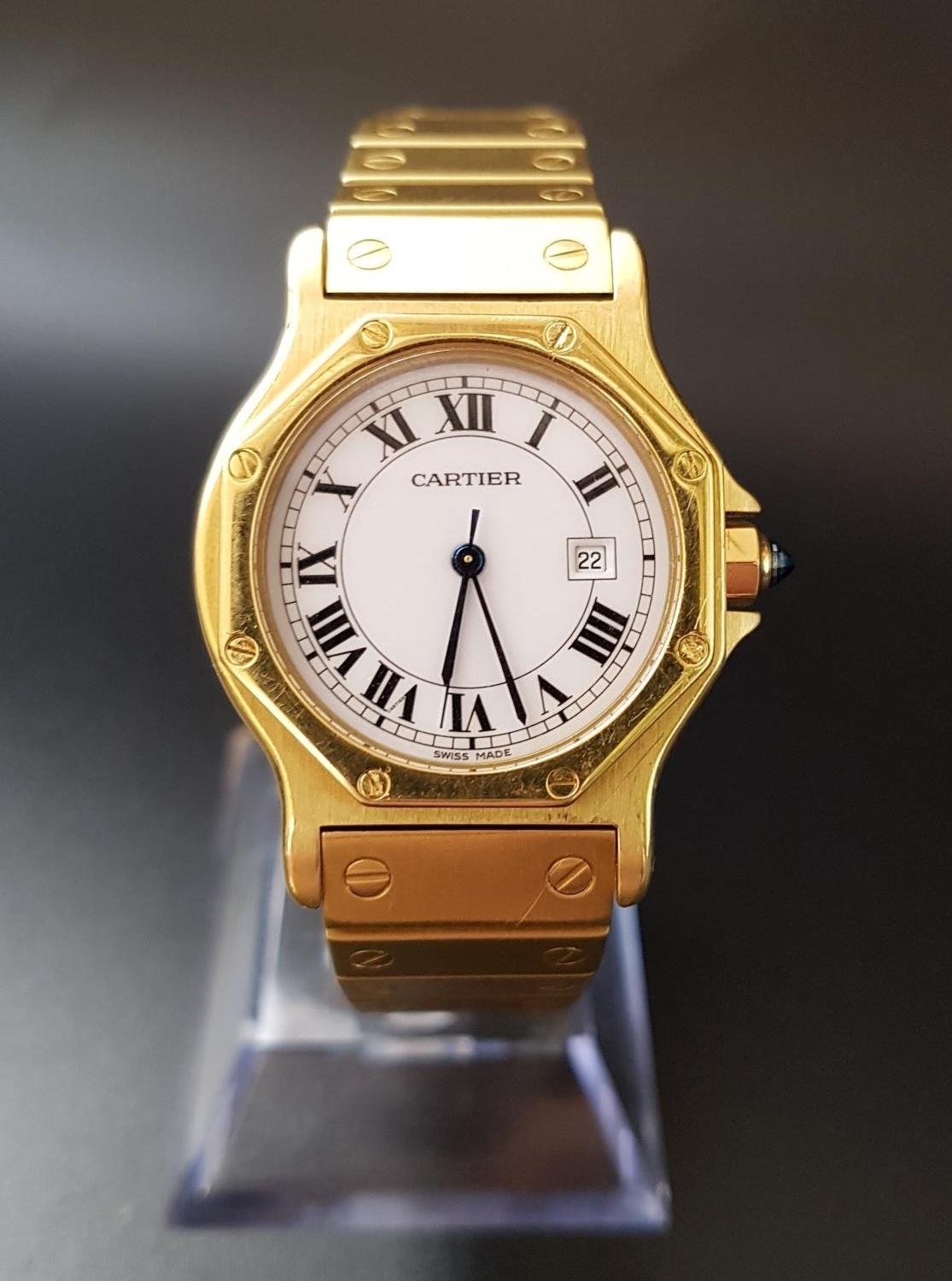 EIGHTEEN CARAT GOLD CARTIER SANTOS OCTAGON AUTOMATIC WRISTWATCH the white dial with Roman numerals