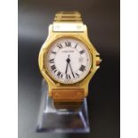 EIGHTEEN CARAT GOLD CARTIER SANTOS OCTAGON AUTOMATIC WRISTWATCH the white dial with Roman numerals