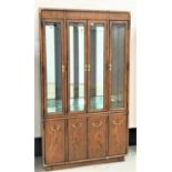 DREXEL PECAN/WALNUT ILLUMINATED DISPLAY CABINET with a plain frieze with brass corners above four