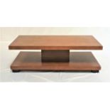 WALNUT VENEER OCCASIONAL TABLE with a rectangular top and open undertier below, standing on stout