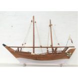TEAK TWIN MAST MODEL OF A SCHOONER with rigging and moving rudder, bearing a presentation plaque,