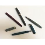 SELECTION OF FOUR VINTAGE FOUNTAIN PENS including three Parker Duofolds with green, grey and brown