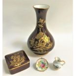 LIMOGES SEOUL PATTERN VASE with a brown ground decorated with trees, plants and houses, 22cm high, a