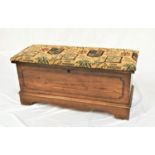 LANE OF VIRGINIA OAK BLANKET BOX with an upholstered padded lift up lid above a carved panel