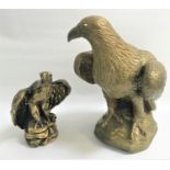 POTTERY EAGLE FIGURINE perched on a rocky base, 43cm high; together with a similar smaller eagle