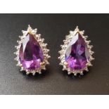 PAIR OF AMETHYST AND DIAMOND CLUSTER STUD EARRINGS each the pear cut amethysts approximately 2.5cts,