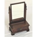 MAHOGANY SWING DRESSING TABLE MIRROR with an oblong plate on square columns with turned finials