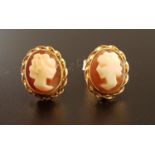 PAIR OF SHELL CAMEO EARRINGS each with female bust in profile, in unmarked gold mounts, the