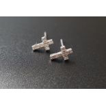 PAIR OF DIAMOND SET CROSS SHAPED STUD EARRINGS in nine carat white gold, each earring