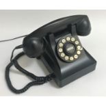 RETRO STYLE BAKELITE TELEPHONE with a faux circular dial pad with push buttons, the underside with