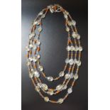 ROCK CRYSTAL AND ORANGE AGATE NECKLACE the four strand necklace with faceted crystasl beads